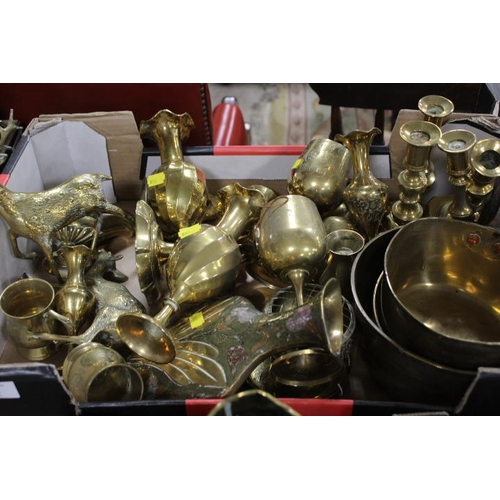 65 - TWO TRAYS OF ASSORTED BRASSWARE TO INCLUDE A PAIR OF TRENCH ART VASES, CANDLESTICKS, SAUCEPANS, HORS... 