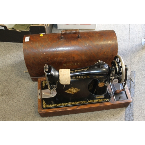 162 - A VINTAGE CASED SINGER SEWING MACHINE