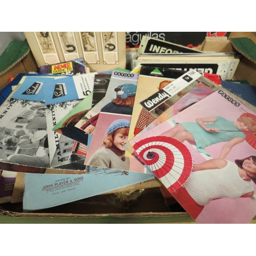 112A - A TRAY OF ASSORTED EPHEMERA / COLLECTABLES TO INCLUDE VINTAGE SEWING PATTERNS, SIGNS, MAGAZINES, ETC