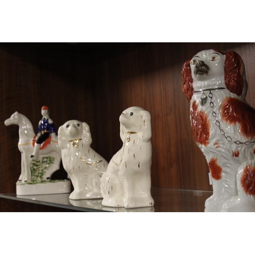 152 - THREE MODERN REPRODUCTION STAFFORDSHIRE FLATBACK SPANIELS TOGETHER WITH A MAN ON HORSEBACK