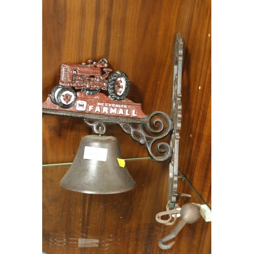 164 - A MODERN REPRODUCTION CAST METAL WALL MOUNTED TRACTOR BELL