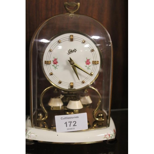 172 - A CARRIAGE CLOCK TOGETHER WITH A PAINTED WOODEN POCKET WATCH STAND (2)