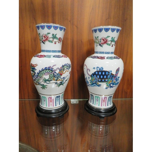 203 - A SET OF TWO FRANKLIN MINT ORIENTAL THEMED PORCELAIN VASES 'THE JOURNEY OF THE HEAVENLY TORTOISE AND... 