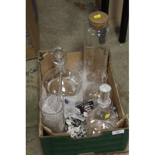 82 - A SMALL TRAY OF GLASS DECANTERS ETC