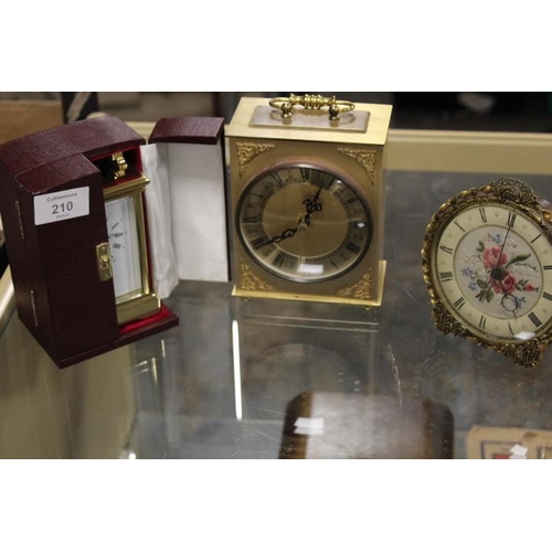 210 - A CASED BRASS DAVID PETERSON CARRIAGE CLOCK TOGETHER WITH TWO OTHER CLOCKS (3)