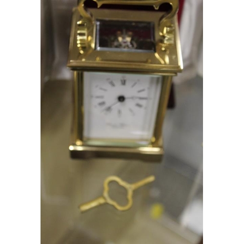 210 - A CASED BRASS DAVID PETERSON CARRIAGE CLOCK TOGETHER WITH TWO OTHER CLOCKS (3)