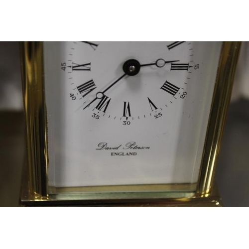 210 - A CASED BRASS DAVID PETERSON CARRIAGE CLOCK TOGETHER WITH TWO OTHER CLOCKS (3)