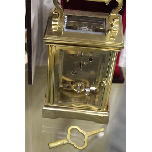 210 - A CASED BRASS DAVID PETERSON CARRIAGE CLOCK TOGETHER WITH TWO OTHER CLOCKS (3)