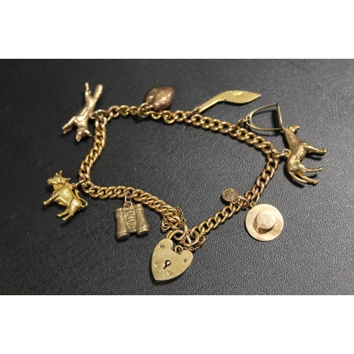 277 - A HALLMARKED 9CT GOLD CHARM BRACELET AND CHARMS, TO INCLUDE EQUESTRIAN EXAMPLES - APPROX WEIGHT 23.9... 