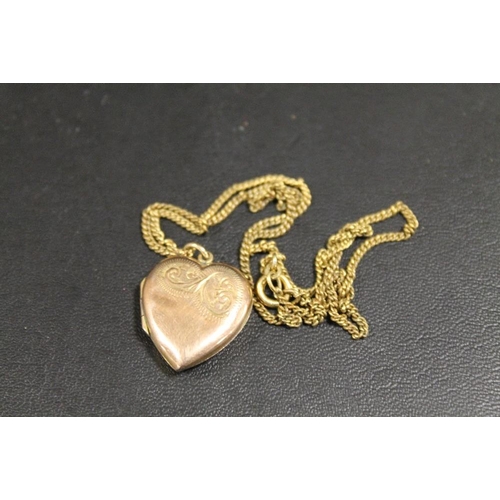 295 - A 9CT GOLD BACK AND FRONT LOCKET ON CHAIN