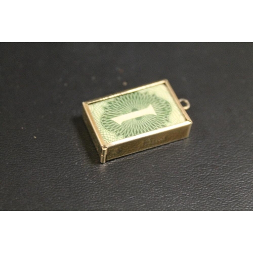 297 - LARGE VINTAGE 9CT GOLD CHARM CONTAINING A £1 NOTE