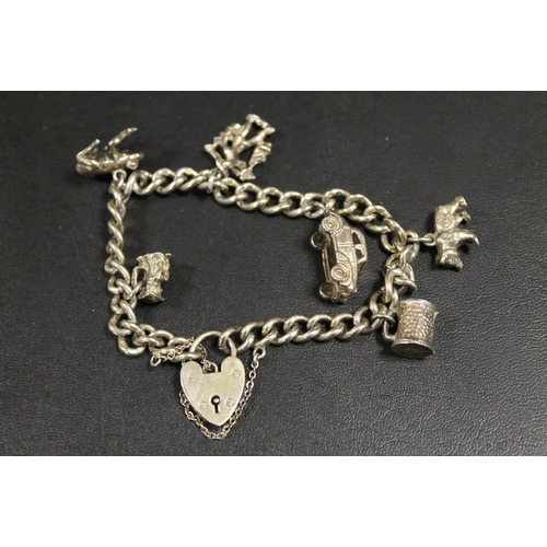 300 - HEAVY HALLMARKED SILVER CHARM BRACELET