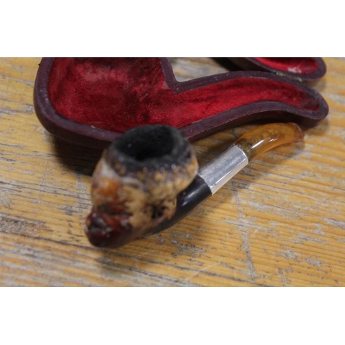 344 - A VINTAGE MEERSCHAUM PIPE IN THE SHAPE OF A BLACK BOY IN A LEATHER COVERED CASE