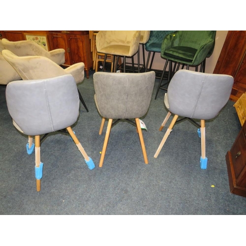 731 - THREE MODERN LEATHER MATCHED DINING CHAIRS