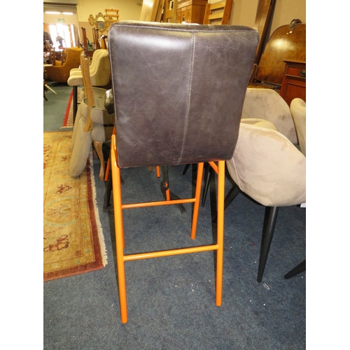 769 - A PAIR OF LEATHER STOOLS WITH ORANGE LEGS