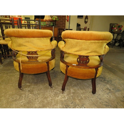 780 - A PAIR OF EDWARDIAN UPHOLSTERED TUB CHAIRS