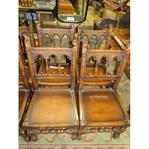 784 - A SET OF TEN JACOBEAN STYLE OAK DINING CHAIRS