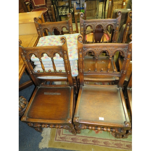 784 - A SET OF TEN JACOBEAN STYLE OAK DINING CHAIRS