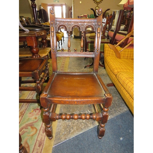 784 - A SET OF TEN JACOBEAN STYLE OAK DINING CHAIRS