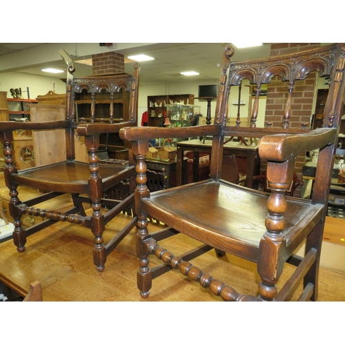 784 - A SET OF TEN JACOBEAN STYLE OAK DINING CHAIRS