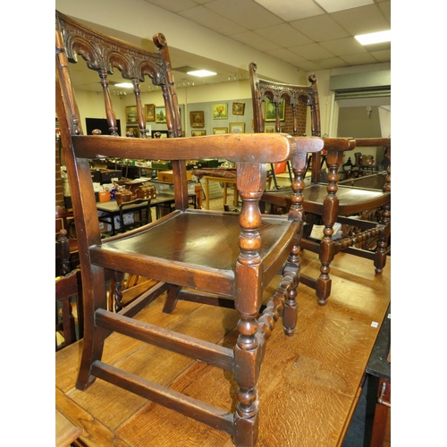 784 - A SET OF TEN JACOBEAN STYLE OAK DINING CHAIRS