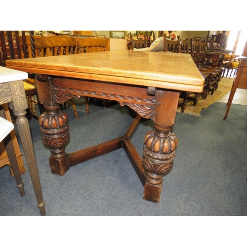 785 - A LARGE OAK JACOBEAN STYLE DRAWLEAF TABLE - W 182 CM EXTENDING TO APPROX W 302 CM