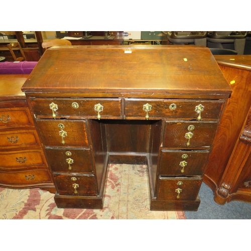 791 - AN ANTIQUE OAK TWIN PEDESTAL DESK - W 94 CM