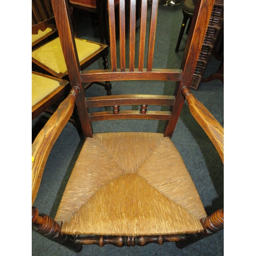 803 - AN ANTIQUE OAK WICKER SEAT ARMCHAIR