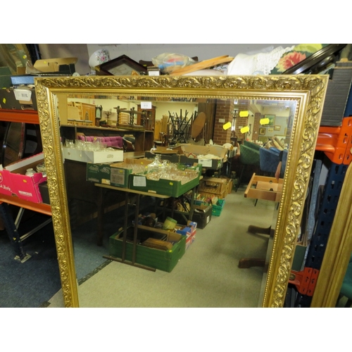 810 - A LARGE MODERN GILT FRAMED MIRROR 130 X 100 CM