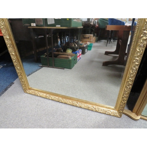 810 - A LARGE MODERN GILT FRAMED MIRROR 130 X 100 CM