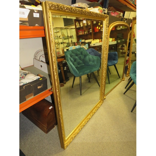 810 - A LARGE MODERN GILT FRAMED MIRROR 130 X 100 CM