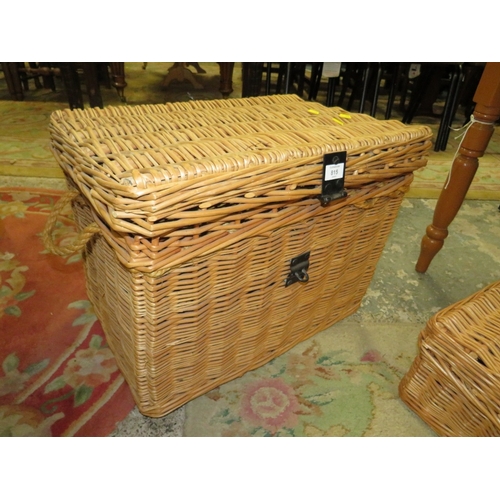 815 - A LARGE WICKER BASKET TOGETHER WITH A SMALLER WICKER HAMPER BASKET