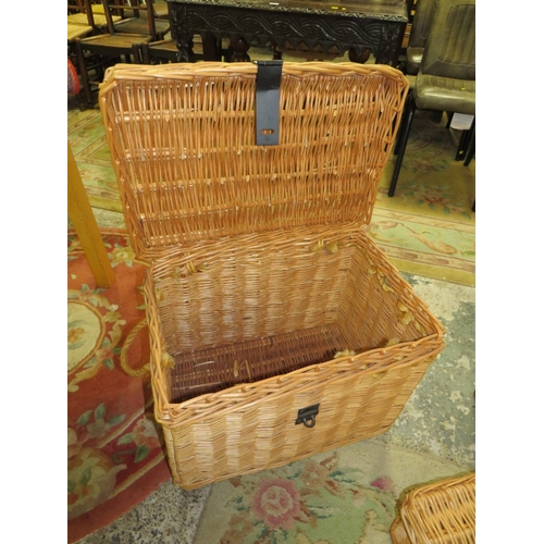 815 - A LARGE WICKER BASKET TOGETHER WITH A SMALLER WICKER HAMPER BASKET