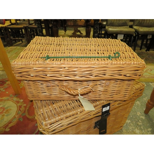 815 - A LARGE WICKER BASKET TOGETHER WITH A SMALLER WICKER HAMPER BASKET