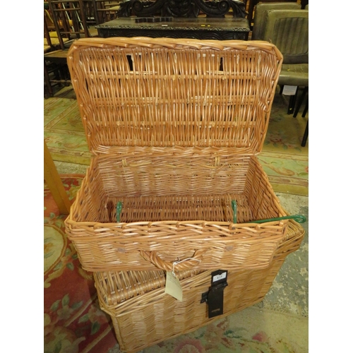 815 - A LARGE WICKER BASKET TOGETHER WITH A SMALLER WICKER HAMPER BASKET