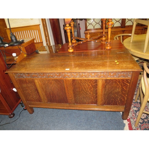 762 - A LATE 19TH / EARLY 20TH CENTURY CARVED OAK COFFER, W 145 CM