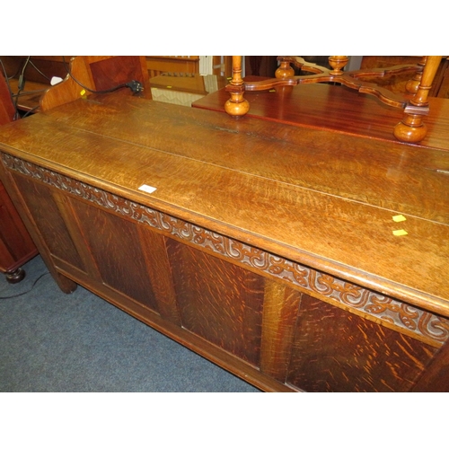 762 - A LATE 19TH / EARLY 20TH CENTURY CARVED OAK COFFER, W 145 CM