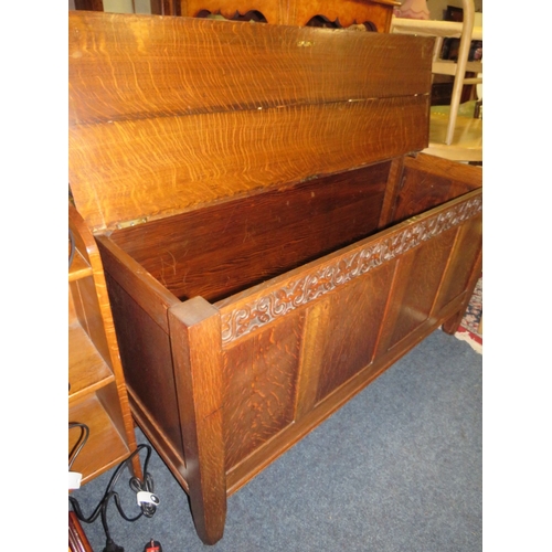 762 - A LATE 19TH / EARLY 20TH CENTURY CARVED OAK COFFER, W 145 CM