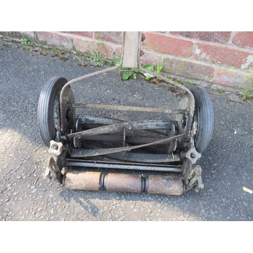 611 - AN ANTIQUE PUSH MOWER