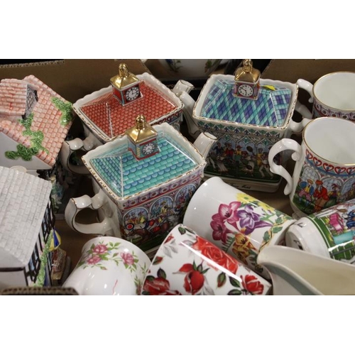 A TRAY OF COLLECTABLE SADLER TEAPOTS, MUGS ETC