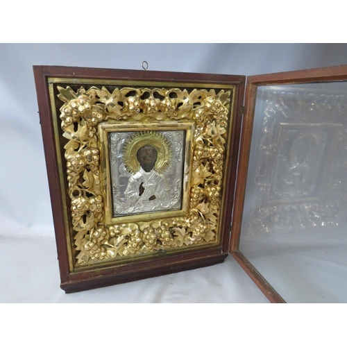 28 - A LATE 18TH / EARLY 19TH CENTURY BOXED AND GLAZED DECORATIVE GOLD FRAME, containing a faded Icon wit... 