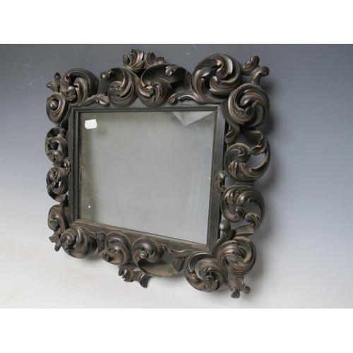 44 - A 19TH CENTURY CONTINENTAL EBONISED AND GILT CARVED DECORATIVE FRAME, glazed, frame W 7.5 cm, rebate... 