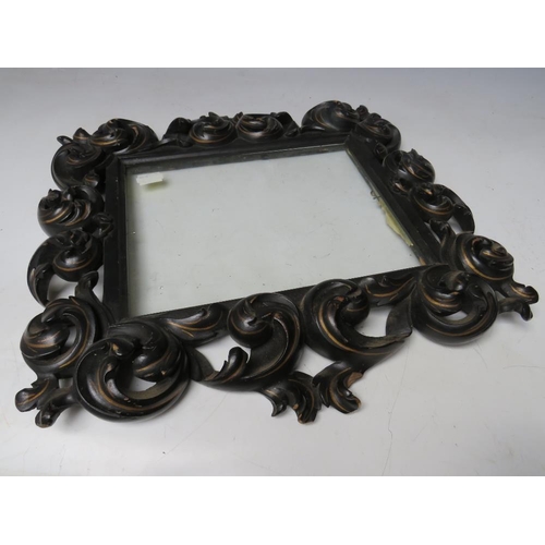 44 - A 19TH CENTURY CONTINENTAL EBONISED AND GILT CARVED DECORATIVE FRAME, glazed, frame W 7.5 cm, rebate... 