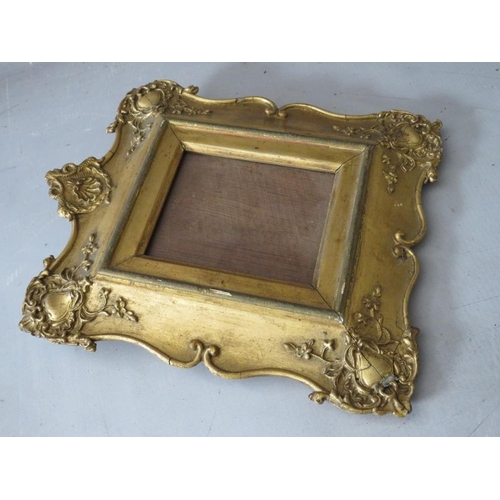 45 - A 19TH CENTURY DECORATIVE GILT MINIATURE FRAME, glazed, frame W 7 cm, rebate 13.5 x 11.5 cm