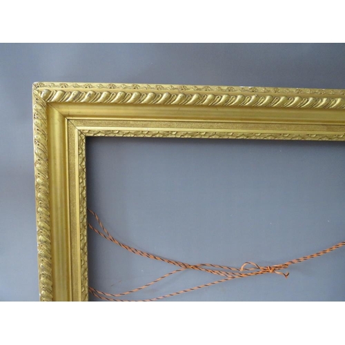 48 - A 19TH CENTURY GOLD FRAME WITH FLOWER DESIGN TO INNER EDGE, leaf design to outer edge, frame W 11 cm... 