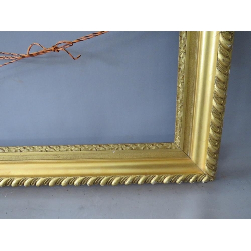 48 - A 19TH CENTURY GOLD FRAME WITH FLOWER DESIGN TO INNER EDGE, leaf design to outer edge, frame W 11 cm... 