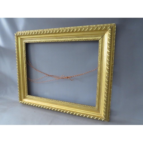 48 - A 19TH CENTURY GOLD FRAME WITH FLOWER DESIGN TO INNER EDGE, leaf design to outer edge, frame W 11 cm... 