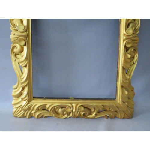 50 - A LATE 18TH / EARLY 19TH CENTURY CARVED WOODEN DECORATIVE GOLD FRAME, frame W 12 cm, rebate 65 x 47 ... 