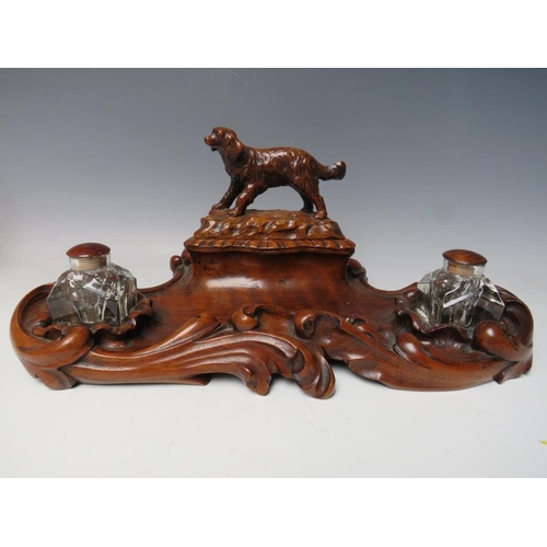 503 - A LATE 19TH / EARLY 20TH CENTURY MAHOGANY DESK TIDY, with pair of inkwells and carved wooden lid in ... 