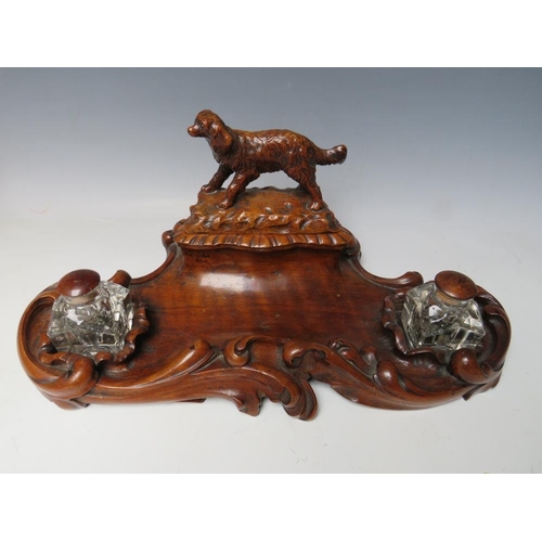 503 - A LATE 19TH / EARLY 20TH CENTURY MAHOGANY DESK TIDY, with pair of inkwells and carved wooden lid in ... 